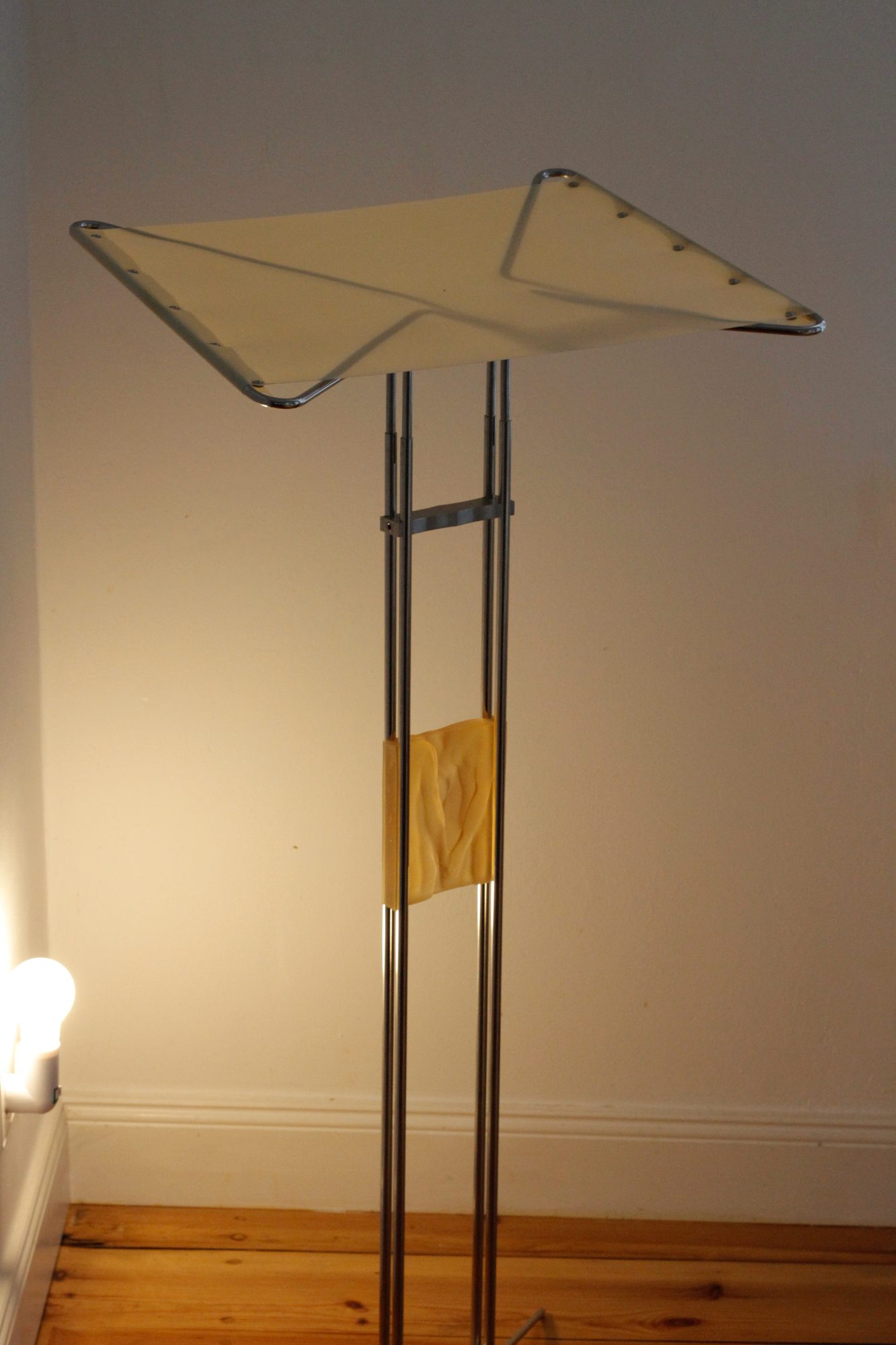 Music stand with a pale yellow rubber relief, installation view
